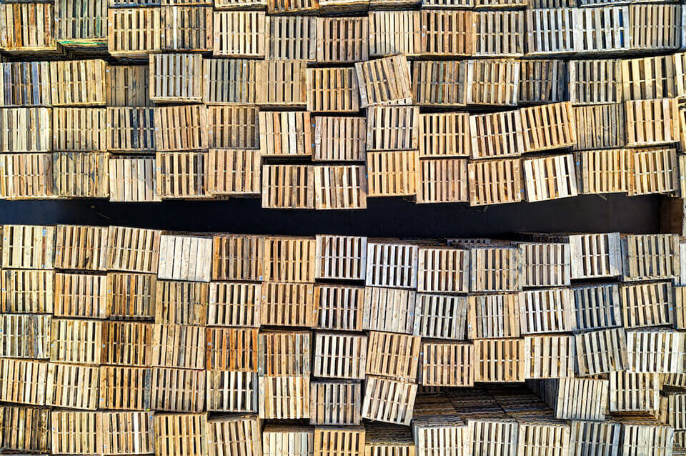 aerial view of many stacks of wood pallets