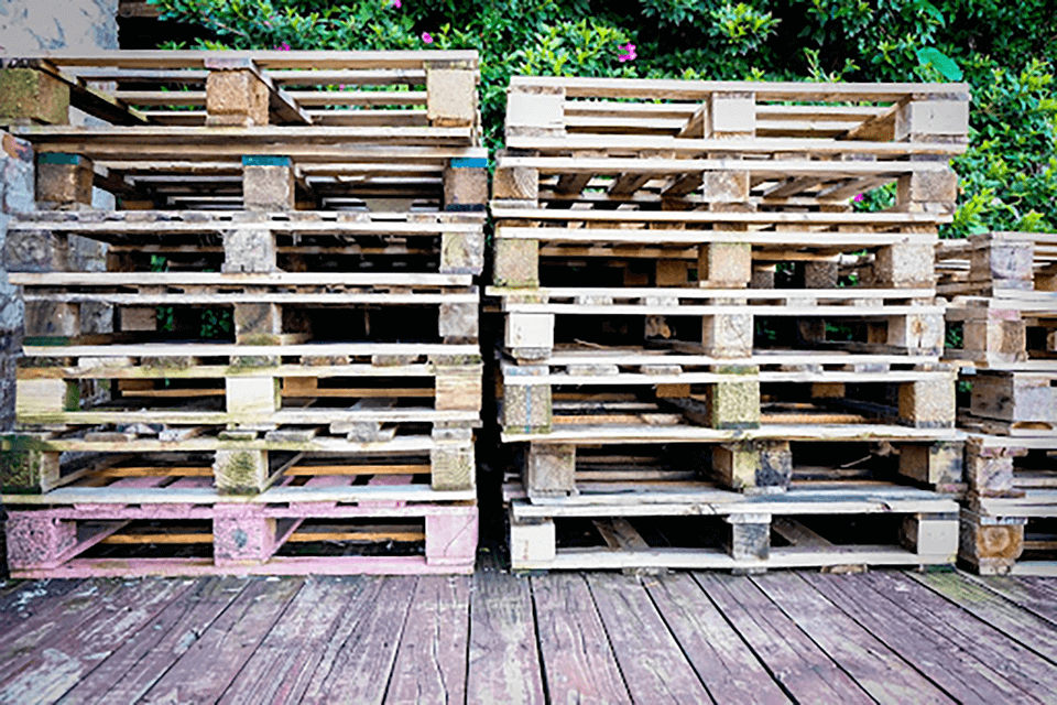 unnamed three stacks of wooden pallets on stored on a deck