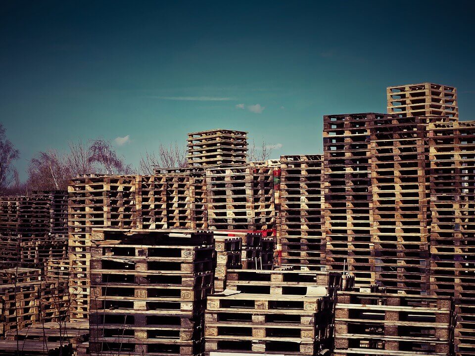 stacks of wood packaging material at a storage facility wooden pallets